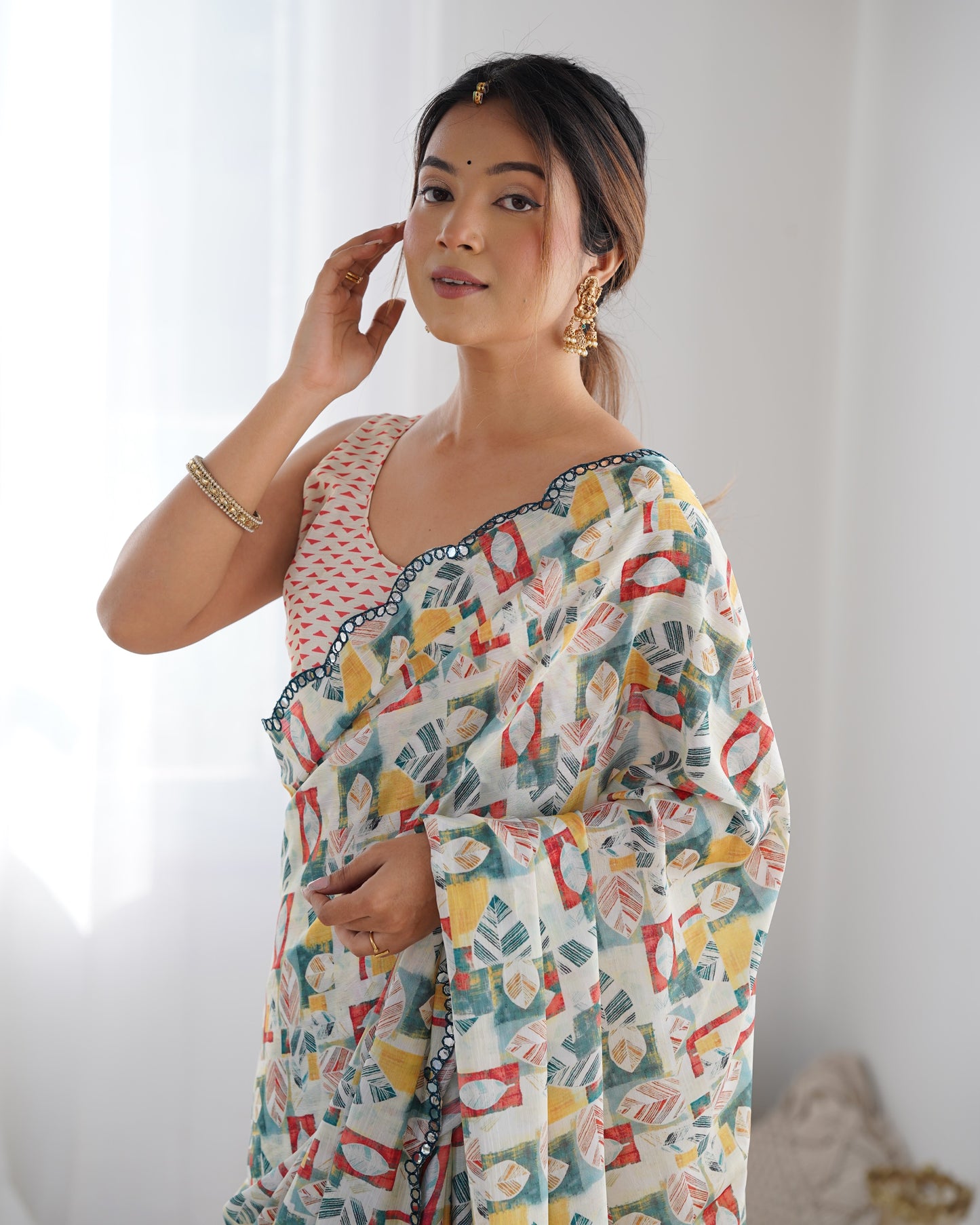 Cream Heavy Chinnon Saree with Print and Kutchi Mirror Lace Border