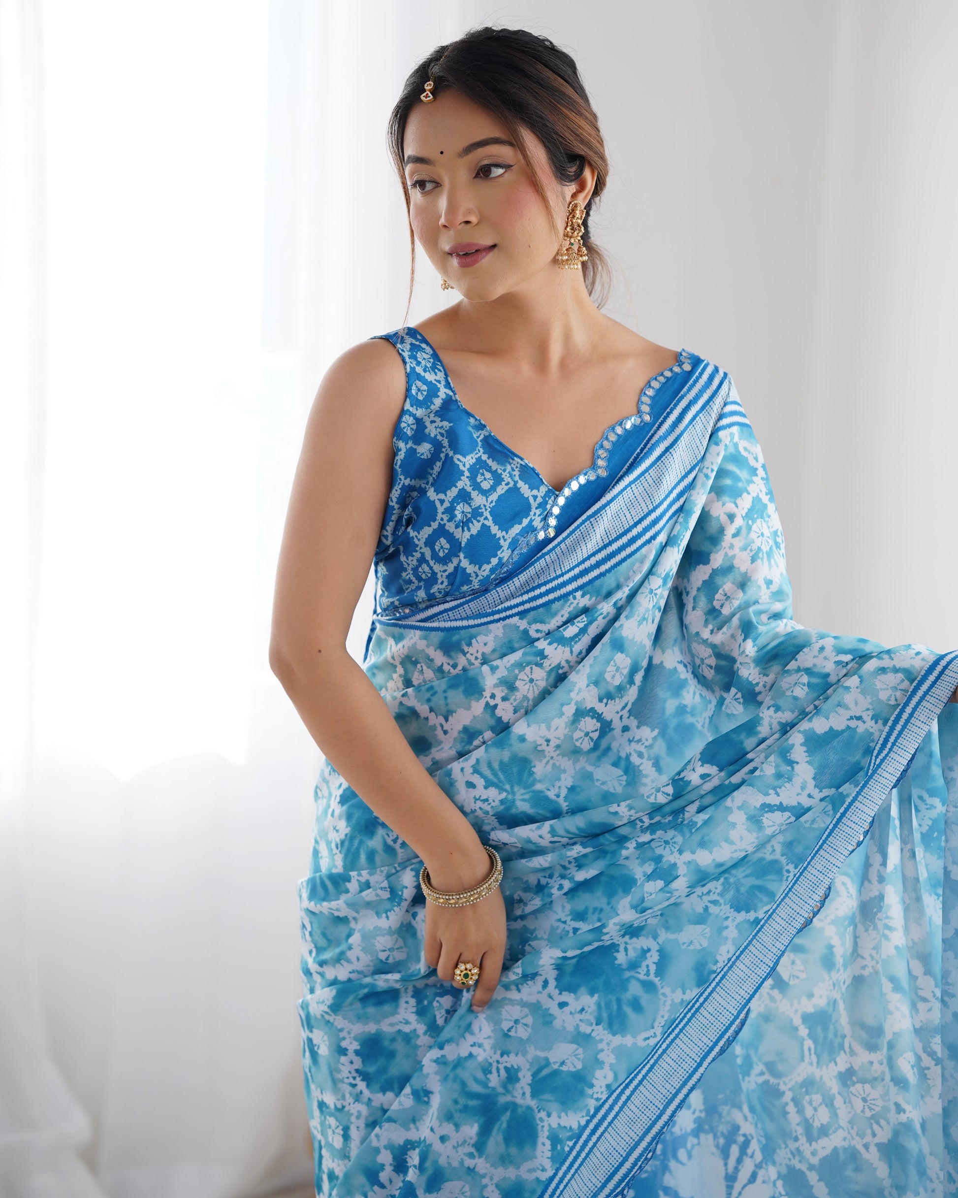 Sky Blue Heavy Chinnon Saree with Print and Kutchi Mirror Lace Border – Available