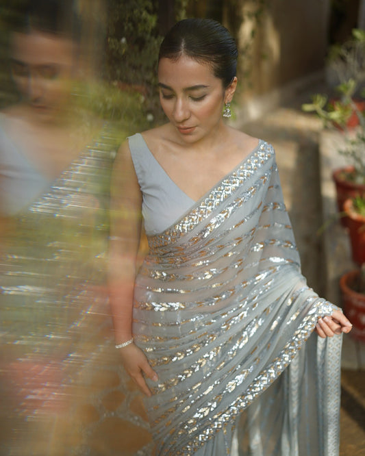 Silver Georgette Saree with Dual sequence embroidery lace with piping