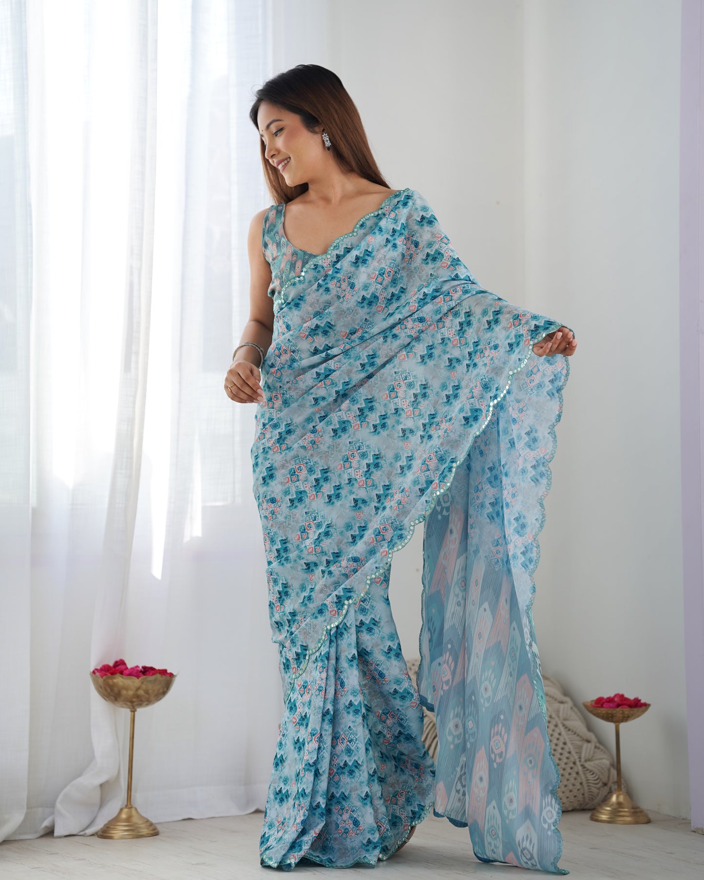 Sky Blue Heavy Chinnon Saree with Print and Kutchi Mirror Lace Border