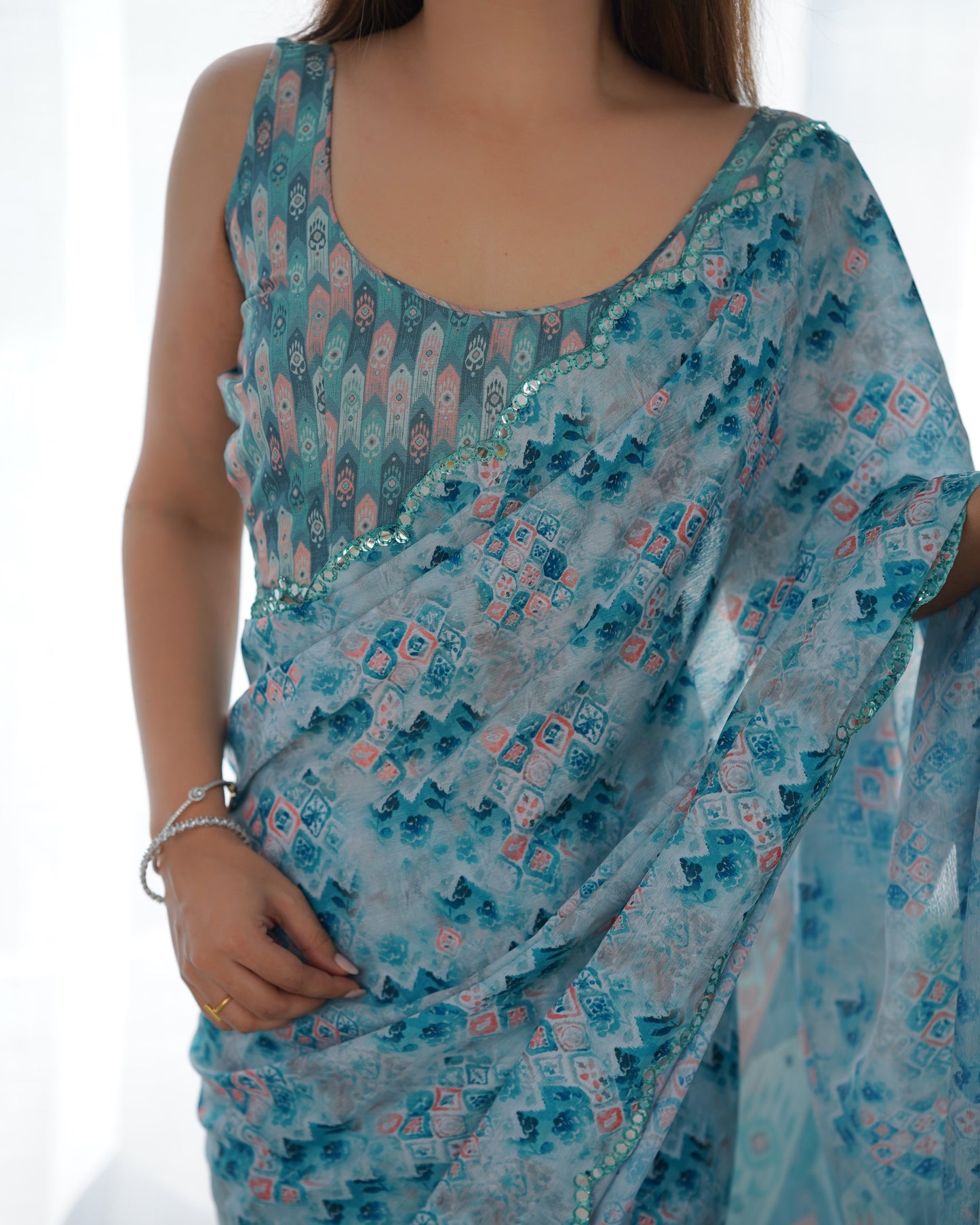 Sky Blue Heavy Chinnon Saree with Print and Kutchi Mirror Lace Border