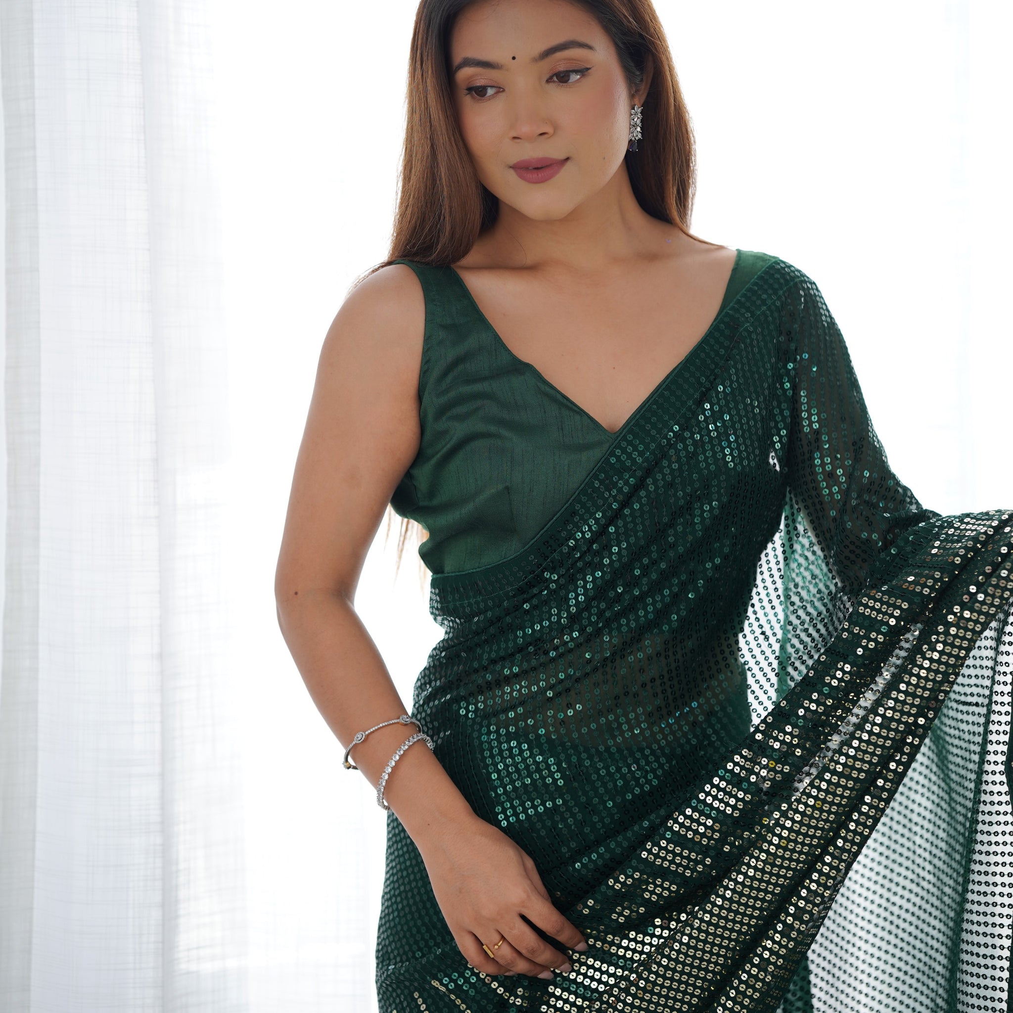 Green Heavy Georgette Saree with Double Run Sequence and Embroidered Piping – Available