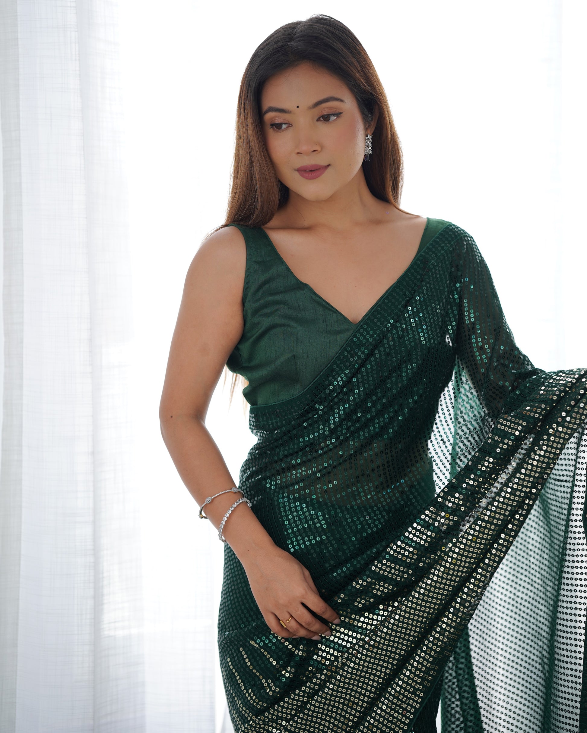 Green Heavy Georgette Saree with Double Run Sequence and Embroidered Piping – Available